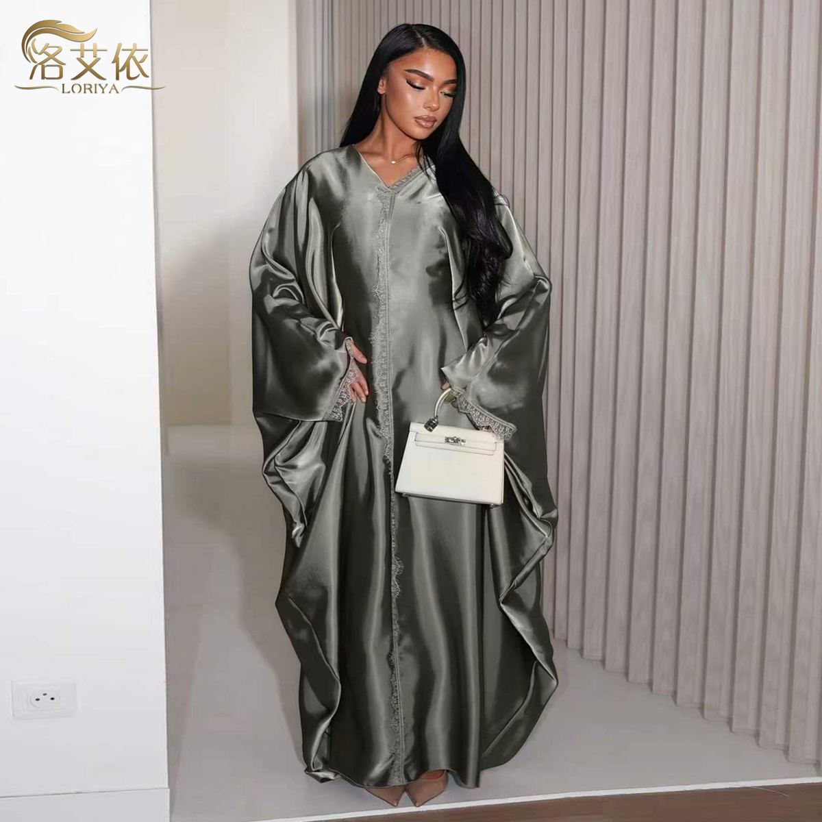 Model in a deep sage green V-neck maxi dress with lace panel — wholesale from Promistars