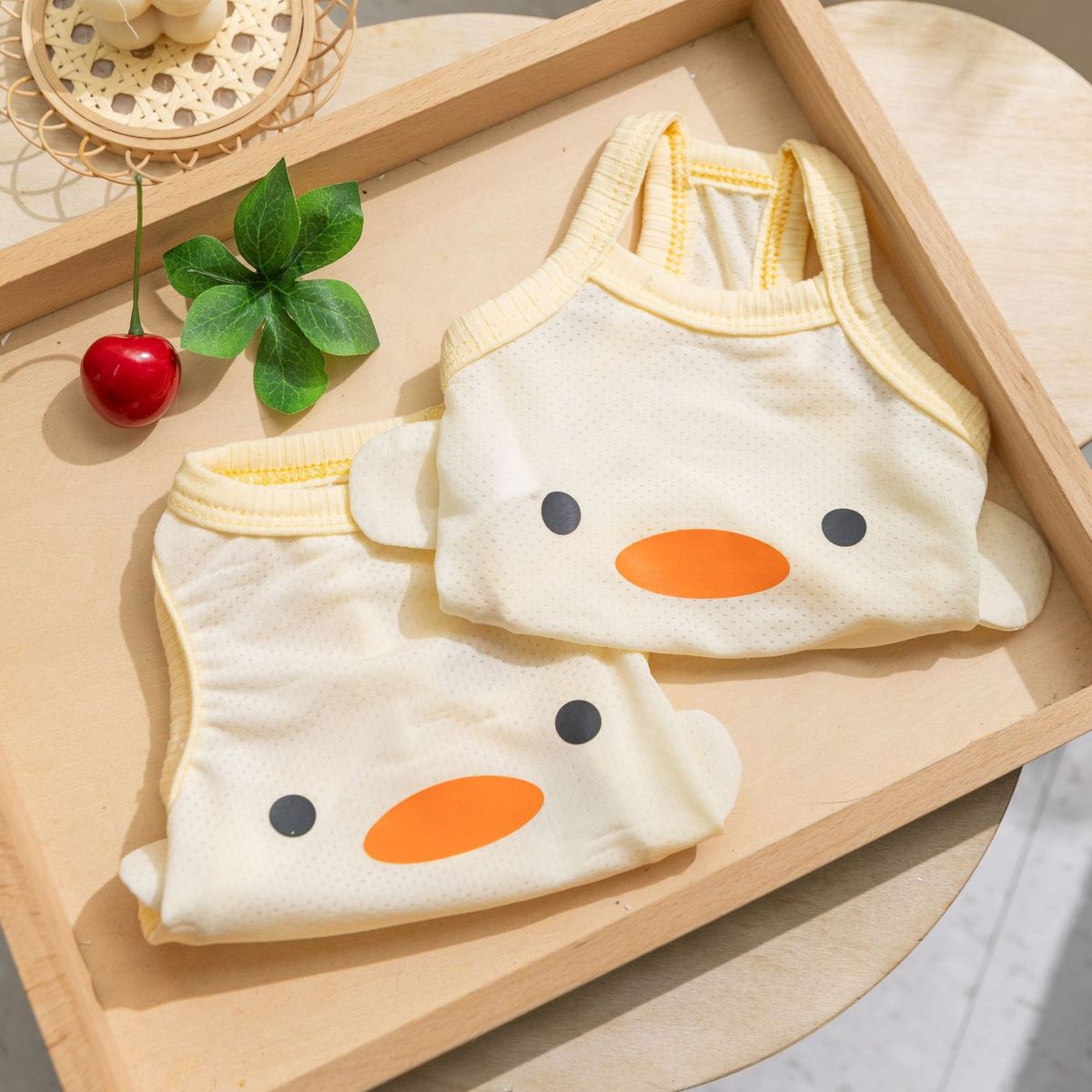 Ivory summer dog tees with duckling face pattern